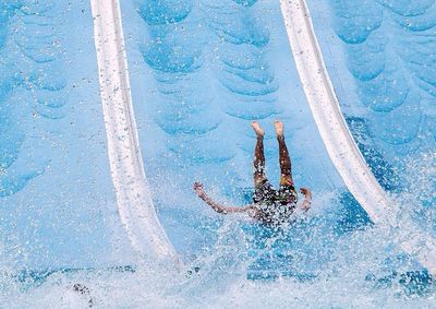 View of a man enjoying water ride