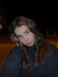 Portrait of young woman looking away