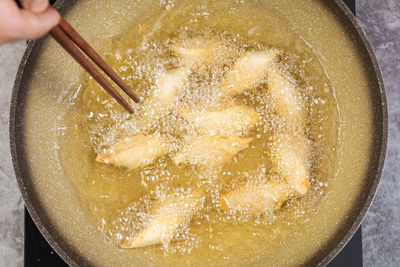 High angle view of person preparing food in bowl