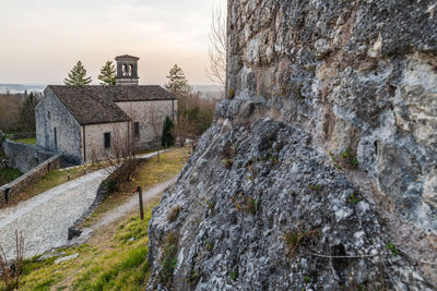 Sunset on the ancient castle of ragogna, italy. fortress guarding the ford on the river tagliamento