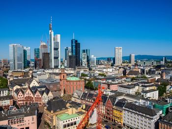 High angle view of old town against modern skyscrapers