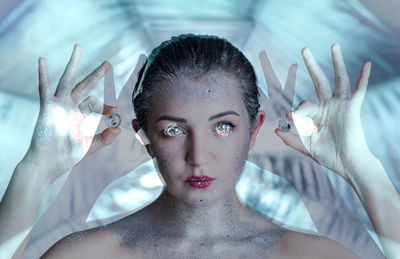 Multiple image of beautiful young woman holding diamonds