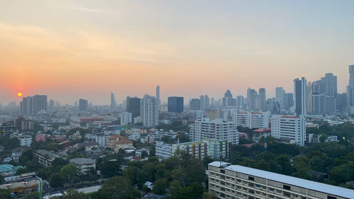 High angle view of buildings against sky during sunset