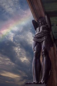 Low angle view of statue against sky