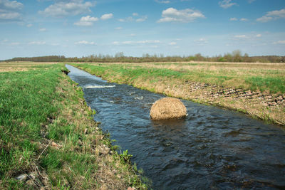 Hay bale in the small river