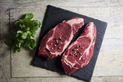 High angle view of meat on cutting board