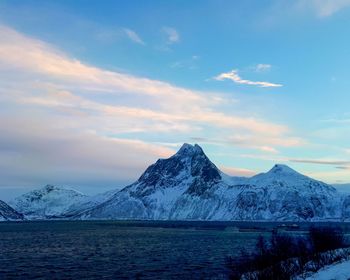 Scenic view of snowcapped mountains against sky during winter