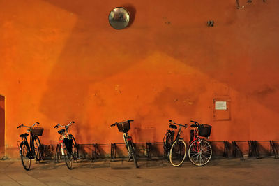 Bicycle parked by wall