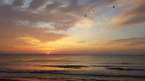 Scenic view of sea against sky during sunset