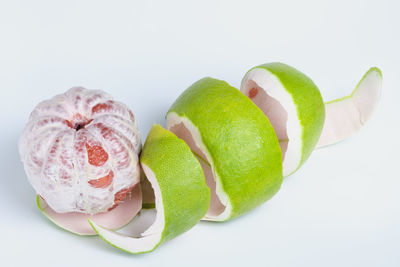 High angle view of fruits against white background