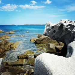 Scenic view of sea against cloudy sky