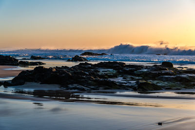 Scenic view of sea against sky during sunset