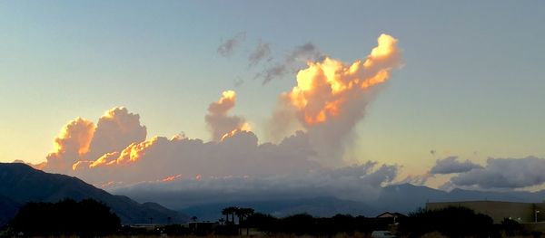 Scenic view of mountains against sky at sunset