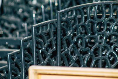 Close-up of metallic chairs