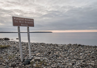 Sign reminding tourists not to remove rocks from shore, acadia, maine