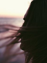 Portrait of woman at beach during sunset