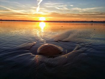 Scenic view of sea at sunset