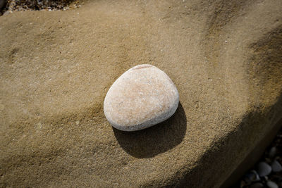 High angle view of stones on sand