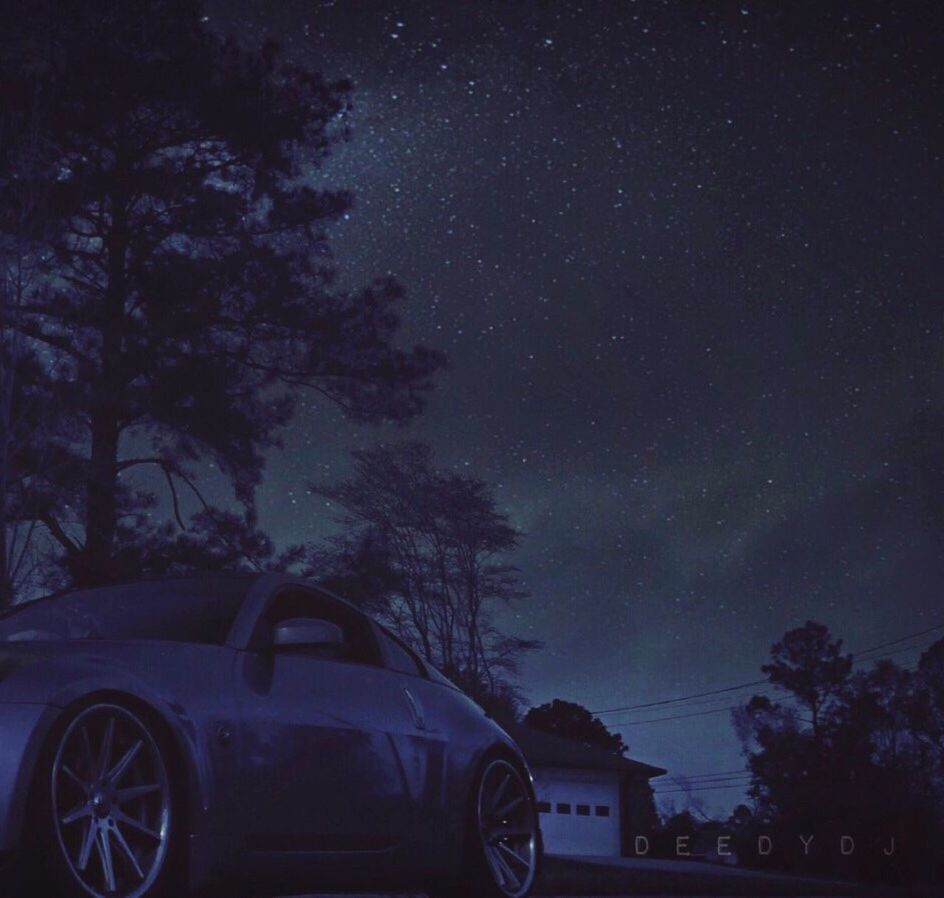 VINTAGE CAR AGAINST SKY AT NIGHT