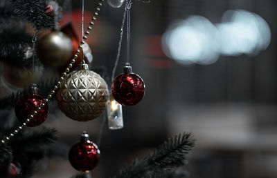 Close-up of christmas decorations hanging on tree