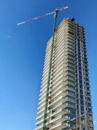 Low angle view of building against blue sky