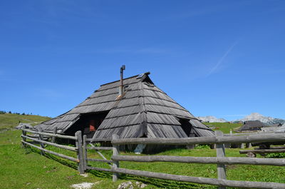 Low angle view of traditional building against clear blue sky