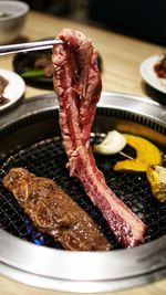 Close-up of meat on barbecue grill