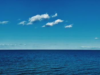 Scenic view of sea against blue sky