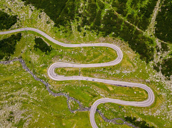 High angle view of winding road amidst trees