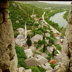 High angle view of river amidst buildings