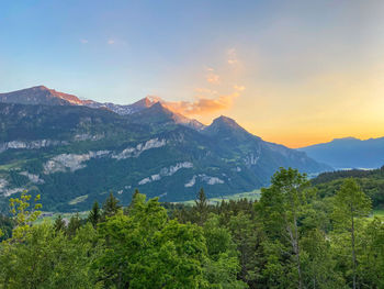 Scenic view of mountains against sky during sunset