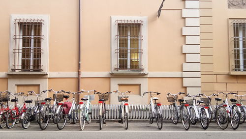 Bicycles parked on street against building