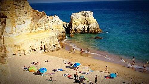 High angle view of tourists on beach