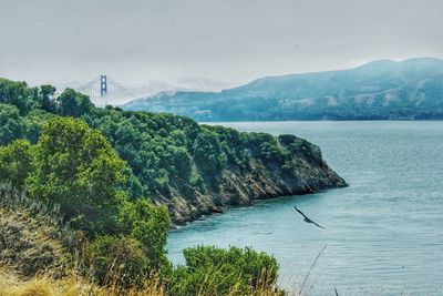 Scenic view of bay against sky