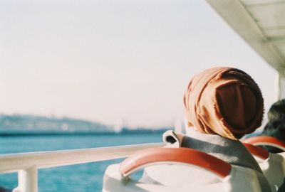 Close-up of coffee with sea in background