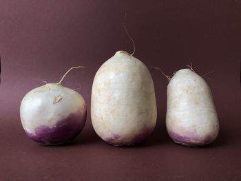 Close-up of fruits on table against black background