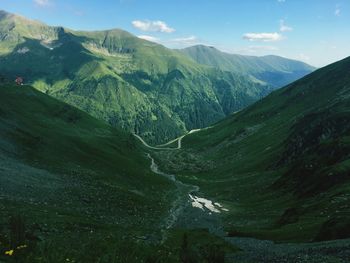 Scenic view of landscape and mountains against sky