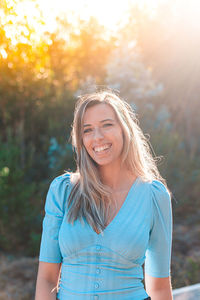 Portrait of a smiling young woman outdoors