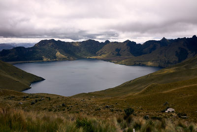 Scenic view of lake and mountains against sky