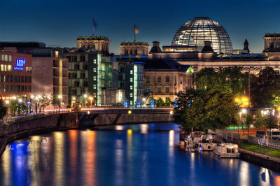 Illuminated buildings in city at night