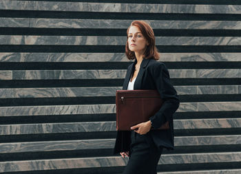 Portrait of young woman using mobile phone