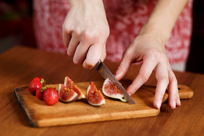 The tasty fruits such as strawberry and fig that are cut on slices