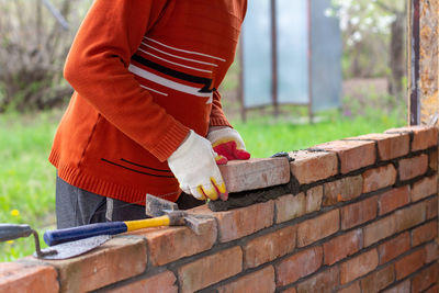 Man working on stone wall