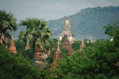 Panoramic view of castle and trees against sky