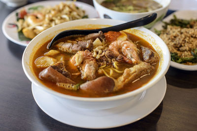 Close-up of food in bowl on wooden table