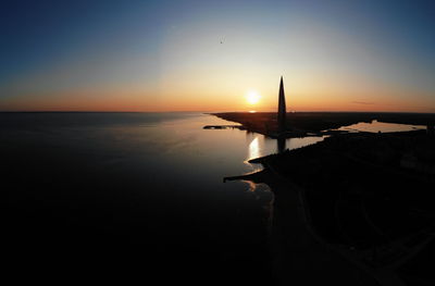 Scenic view of sea against sky at sunset