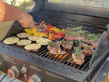 High angle view of people on barbecue grill