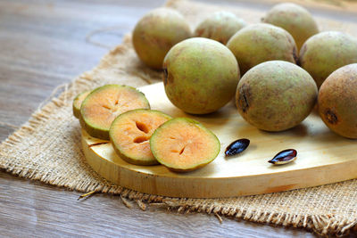 Close-up of fruits in plate on table