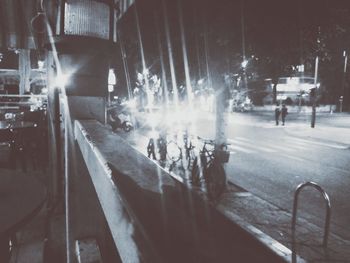 Group of people walking on road at night