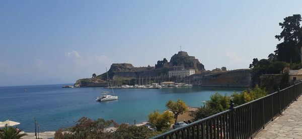 Panoramic view of sea and buildings against sky